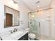 Updated bathroom featuring a glass shower, modern vanity, and neutral color palette at 10580 Saddlestone Dr, Fishers, IN 46040
