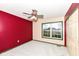 Bedroom featuring bright red walls and a ceiling fan at 10580 Saddlestone Dr, Fishers, IN 46040