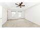 Bright bedroom with carpeted floor, tray ceiling, and windows for natural light at 10580 Saddlestone Dr, Fishers, IN 46040