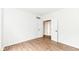 An empty bedroom features wood look floors, white walls, and a closet at 10580 Saddlestone Dr, Fishers, IN 46040
