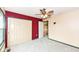 Bedroom featuring red accent wall, closet, and neutral carpet at 10580 Saddlestone Dr, Fishers, IN 46040