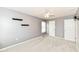 Neutral bedroom with floating shelves and a ceiling fan at 10580 Saddlestone Dr, Fishers, IN 46040