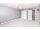 Neutral bedroom with a closet, a door, and carpeted floors at 10580 Saddlestone Dr, Fishers, IN 46040