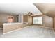 Carpeted bonus room with dormer windows providing plenty of natural light and cozy feel at 10580 Saddlestone Dr, Fishers, IN 46040