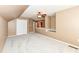 Cozy bonus room with plush carpeting, dormer window, and ample natural light at 10580 Saddlestone Dr, Fishers, IN 46040