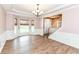 Elegant dining room with hardwood floors, wainscoting, and bay window at 10580 Saddlestone Dr, Fishers, IN 46040