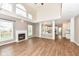 Bright living room with hardwood floors, fireplace, and seamless transition to the kitchen at 10580 Saddlestone Dr, Fishers, IN 46040