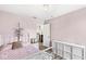 Bedroom featuring pink walls, a white metal bed, hard surface flooring, and white storage shelves at 11789 Langham Crescent Ct, Fishers, IN 46037