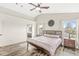Bedroom featuring a wood frame bed, ceiling fan, hard surface flooring, and neutral walls at 11789 Langham Crescent Ct, Fishers, IN 46037