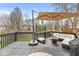 Outdoor deck features a relaxing lounge area and a cozy fire pit, perfect for entertaining and enjoying the outdoors at 11789 Langham Crescent Ct, Fishers, IN 46037