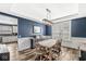 Dining room featuring a rustic wooden table and ample natural light at 11789 Langham Crescent Ct, Fishers, IN 46037