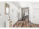 Entryway with wood floors and view of a home office at 11789 Langham Crescent Ct, Fishers, IN 46037