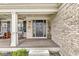 Welcoming front porch leading to an elegant black front door at 11789 Langham Crescent Ct, Fishers, IN 46037