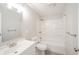 Bright bathroom featuring a shower-tub combo and a white vanity sink at 1219 Fairfax St, Anderson, IN 46012