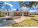 Charming brick ranch home with attached garage and landscaped front yard at 1219 Fairfax St, Anderson, IN 46012