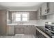 Efficient kitchen features updated appliances and ample countertop space at 1219 Fairfax St, Anderson, IN 46012