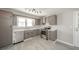 Well-lit kitchen featuring modern appliances and stylish flooring at 1219 Fairfax St, Anderson, IN 46012