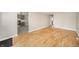 Open-concept layout connecting the living room to the kitchen, featuring hardwood floors at 1219 Fairfax St, Anderson, IN 46012