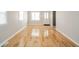 Inviting living room featuring pristine hardwood floors and fresh neutral paint at 1219 Fairfax St, Anderson, IN 46012