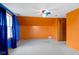 Bedroom with orange and blue walls, a ceiling fan, and a window for ample natural light at 1243 S Morristown Pike, Greenfield, IN 46140