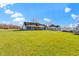 Spacious two-story house featuring well-manicured lawn, storage sheds, and a serene countryside setting at 1243 S Morristown Pike, Greenfield, IN 46140
