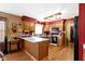 Kitchen featuring hardwood floors, oak cabinets, white countertops, and modern appliances at 1243 S Morristown Pike, Greenfield, IN 46140