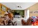 Cozy living room with carpet, a ceiling fan, natural light and wooden accents, creates an inviting space at 1243 S Morristown Pike, Greenfield, IN 46140