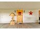 Cozy front porch featuring a wooden door, farmhouse decor and inviting details, with rustic charm at 1243 S Morristown Pike, Greenfield, IN 46140