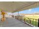 Spacious covered porch showcasing rustic accents, offering a relaxing area with open views of the surrounding landscape at 1243 S Morristown Pike, Greenfield, IN 46140