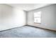 A gray bedroom with soft gray carpet flooring and natural light at 12702 Slippery Rock Rd, Indianapolis, IN 46236