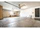 Spacious garage featuring built-in cabinets, utility sink, and ample storage space for vehicles and projects at 12702 Slippery Rock Rd, Indianapolis, IN 46236