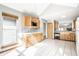 Bright kitchen featuring tile floors, wood cabinets, a mosaic backsplash and stainless steel appliances at 12702 Slippery Rock Rd, Indianapolis, IN 46236