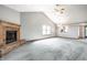 Bright living room with fireplace and high vaulted ceilings leading to an open kitchen, ideal for gathering and entertaining at 12702 Slippery Rock Rd, Indianapolis, IN 46236