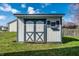 Well-maintained shed providing extra storage space with charming design, blending function with aesthetic appeal at 12702 Slippery Rock Rd, Indianapolis, IN 46236