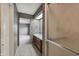 Bathroom featuring vintage wall coverings, walk-in shower and ample storage, offering a functional layout at 138 President W Trl, Indianapolis, IN 46229