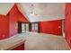 Large bedroom featuring high ceilings, a ceiling fan, neutral carpet, and sliding glass doors at 138 President W Trl, Indianapolis, IN 46229