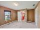Bedroom with neutral walls, a window, with view to the outdoors, and carpet flooring at 138 President W Trl, Indianapolis, IN 46229