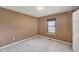 Bedroom featuring neutral walls and carpet, a window letting in natural light at 138 President W Trl, Indianapolis, IN 46229