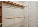 Spacious walk-in closet with built-in shelving and ample hanging space, providing efficient storage solutions at 138 President W Trl, Indianapolis, IN 46229