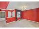 Dining room featuring a chandelier, neutral carpet and an open doorway to the hall at 138 President W Trl, Indianapolis, IN 46229