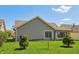 Side exterior of home with gray siding and lovely green lawn on a sunny day at 138 President W Trl, Indianapolis, IN 46229