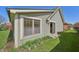 Exterior view of the home with siding, windows, and a sliding glass door to the backyard at 138 President W Trl, Indianapolis, IN 46229