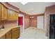 Functional kitchen features wood cabinets, laminate countertops, and black appliances, offering a practical space for meal preparation at 138 President W Trl, Indianapolis, IN 46229