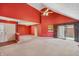 Large living room with high ceilings, neutral carpet, and ample natural light at 138 President W Trl, Indianapolis, IN 46229