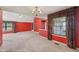 Open living room featuring high ceilings, a ceiling fan, neutral carpet, and bright light at 138 President W Trl, Indianapolis, IN 46229