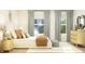Bright bedroom with large windows, stylish curtains, and chic decor for a relaxing and elegant space at 15371 Alperton Rd, Fishers, IN 46037