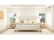 Bright bedroom with a king bed, stylish bedside tables, and soft natural light at 15371 Alperton Rd, Fishers, IN 46037