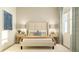 Serene bedroom featuring a king-sized bed, neutral tones, and natural light at 15371 Alperton Rd, Fishers, IN 46037