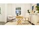 This stylish office boasts a wood desk and comfortable chair next to a bright window at 15371 Alperton Rd, Fishers, IN 46037