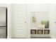 A functional mud room with bench seating, storage baskets, and convenient hooks at 15371 Alperton Rd, Fishers, IN 46037